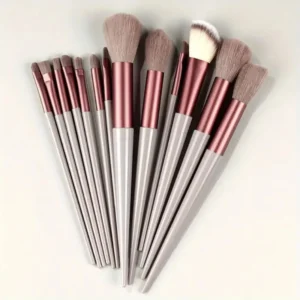 Makeup brush set with synthetic bristles featuring various handle colors