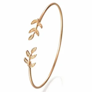 Open cuff bracelet with delicate leaf design on a white background