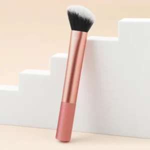 Facial brightening and contouring brush with orange handle and nylon bristles