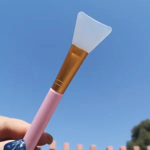 Soft silicone facial mask brush with angled handle in multiple colors