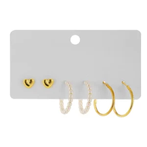 Set of metal geometric stud and hoop earrings with faux pearls