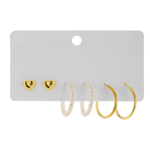 Set of metal geometric stud and hoop earrings with faux pearls