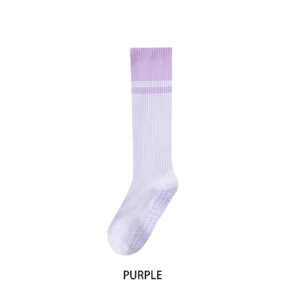 Pair of women's long cotton blend yoga socks with silicone grips on soles