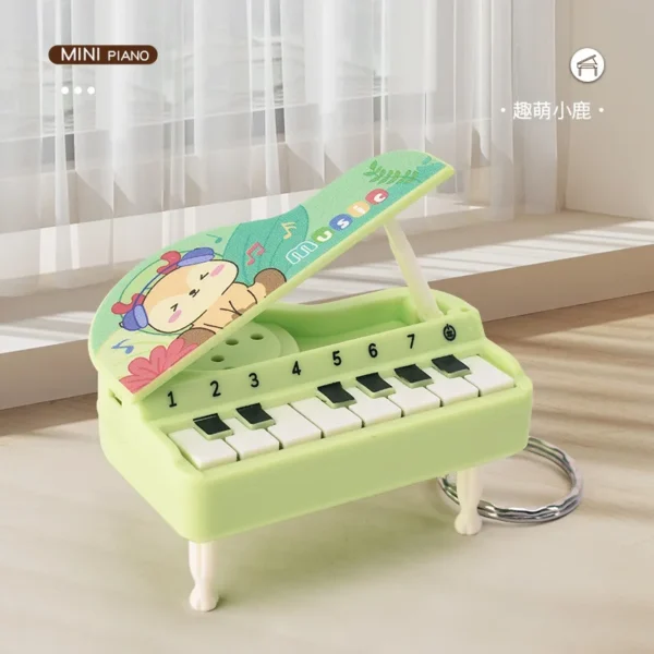 Mini handheld glowing electronic piano keychain in assorted colors attached to a keyring