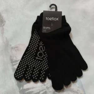 Pair of Toesox cotton five-toe socks with anti-slip grips on soles
