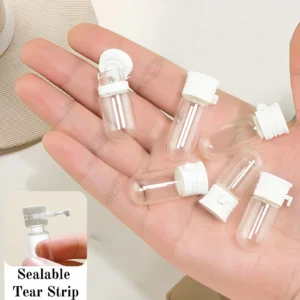 Set of ten small transparent glass travel bottles with white leak-proof caps