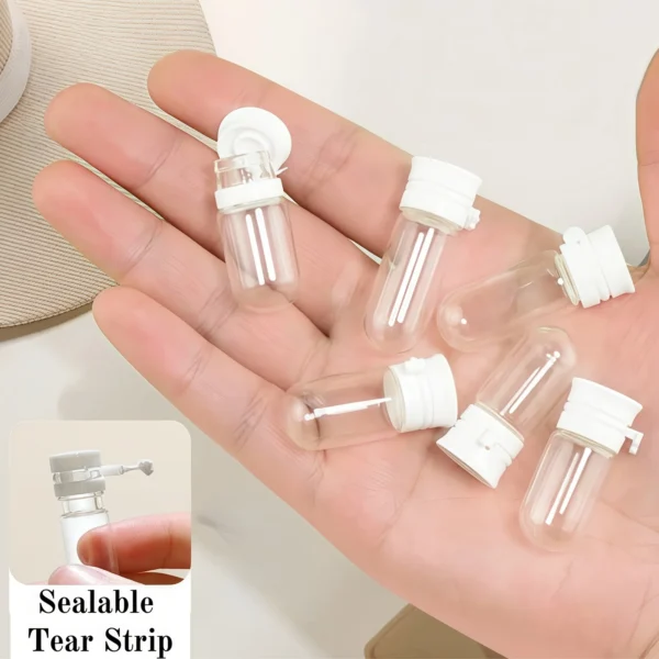 Set of ten small transparent glass travel bottles with white leak-proof caps