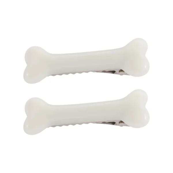 Two black and white geometric dog bone shaped acrylic hair clips