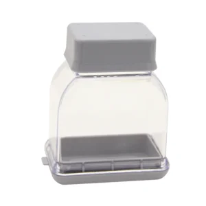 Gray manual garlic press and grater kitchen tool