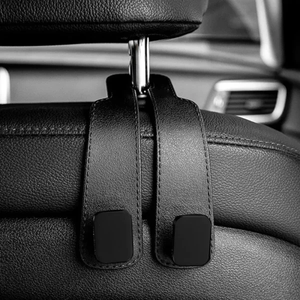 Car headrest hook attached to vehicle seat showing bag hanging