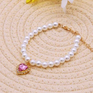 Adjustable kitten collar with simulated pearls on white background