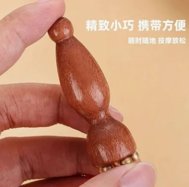 Handheld brass and rosewood lotus seedpod shaped facial gua sha tool