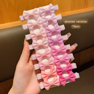 Set of 30 assorted colored bow fabric hair clips on white background