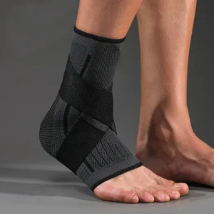 Adjustable breathable ankle support brace with knit compression sleeve on white background