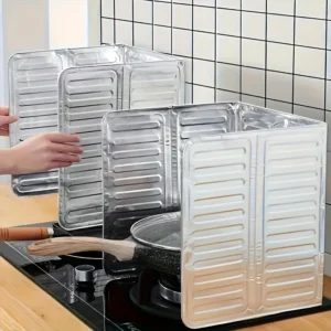 Foldable aluminum foil splash guard placed on gas stove burner