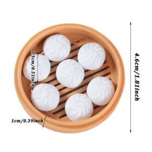 3D mini steamer bun dumpling shaped fridge magnet holding a note on refrigerator door