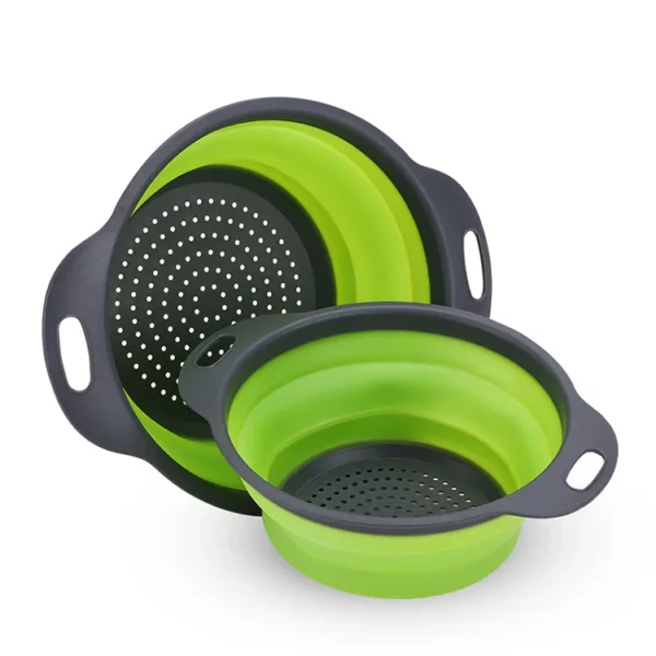 Collapsible silicone basket in green color holding assorted fruits and vegetables