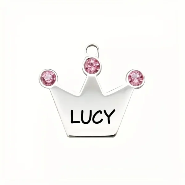 Zinc alloy pet ID tag with pink crown and rhinestones on a white background
