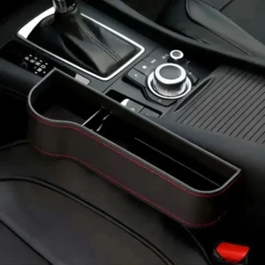 Black universal car seat gap storage box installed between car seat and console