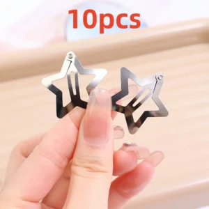 silver star-shaped metal snap hair clips arranged on white background