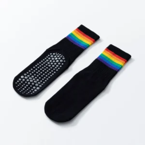 Women’s black mid-tube cotton yoga socks with rainbow stripes and anti-slip soles