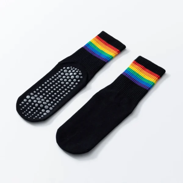 Women’s black mid-tube cotton yoga socks with rainbow stripes and anti-slip soles